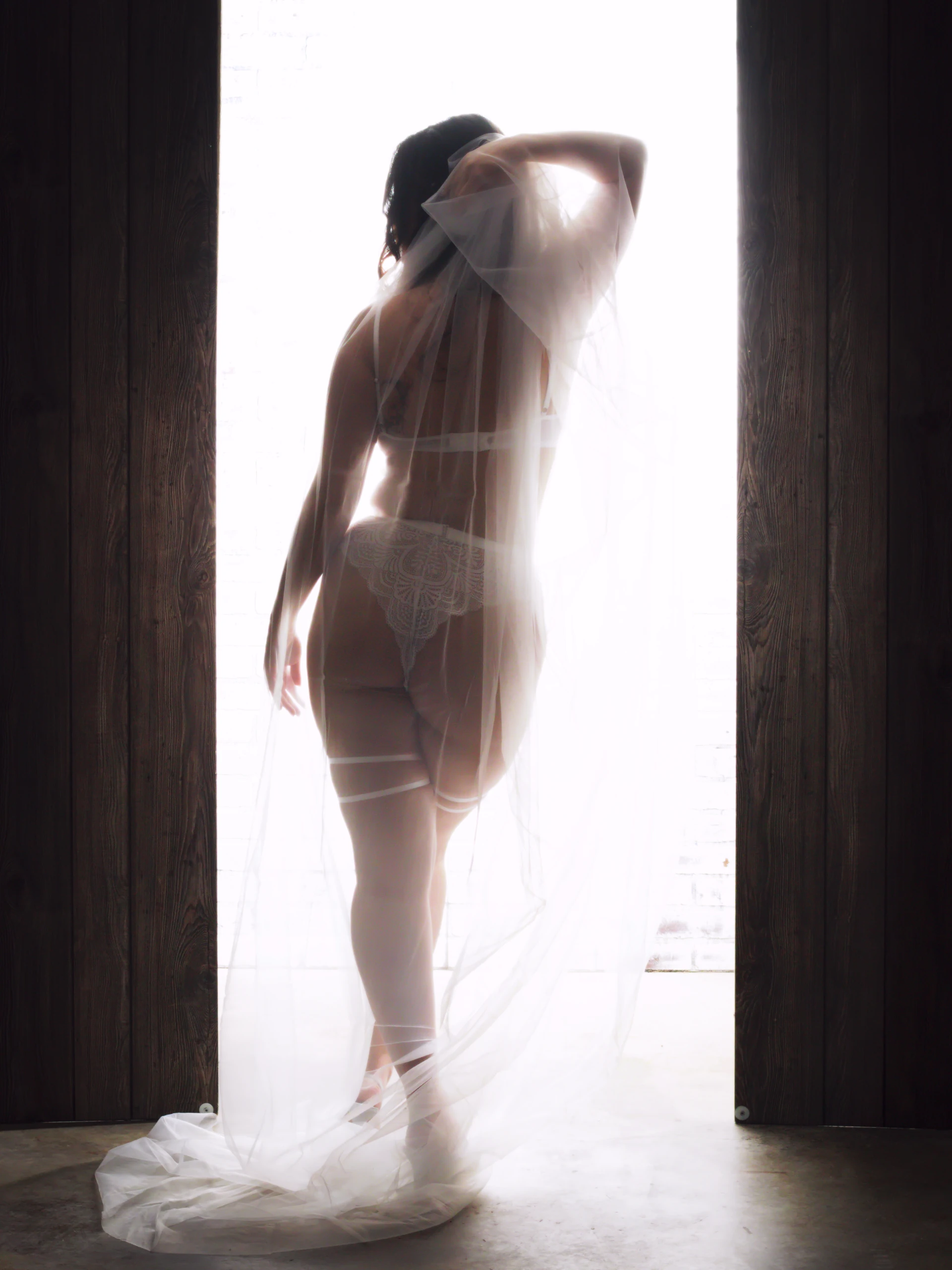 San Antonio bridal boudoir portrait with elegant veil and soft romantic light