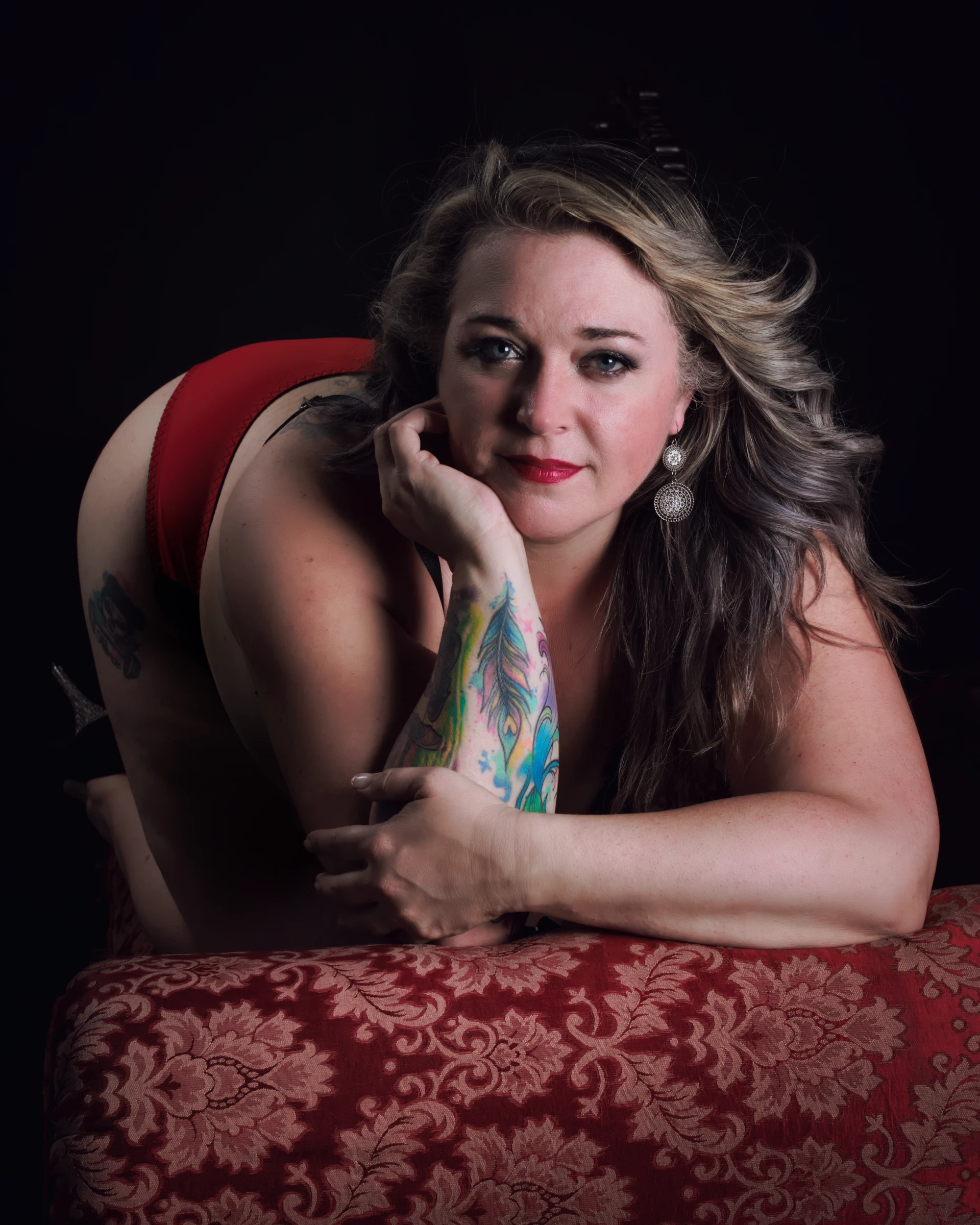 Plus size boudoir portrait for women over 40 with classic studio lighting